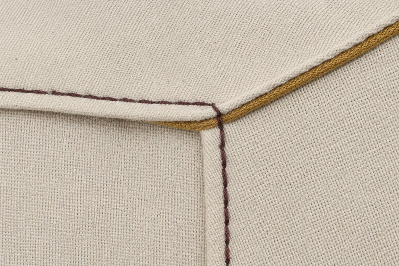 Macro photograph of the seam produced by attach the collar unit to the neckline