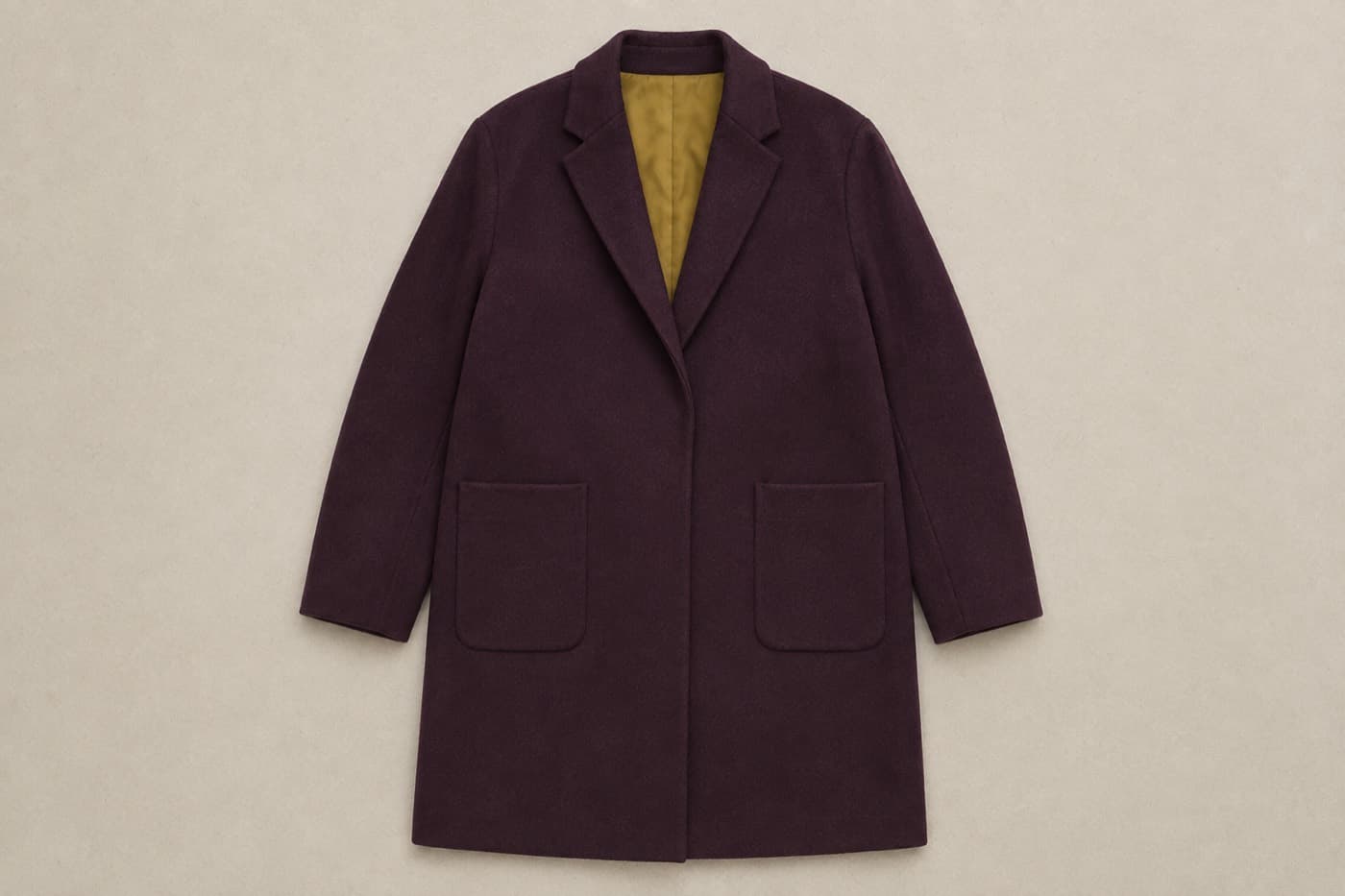 A finished unstructured coat, laid out flat